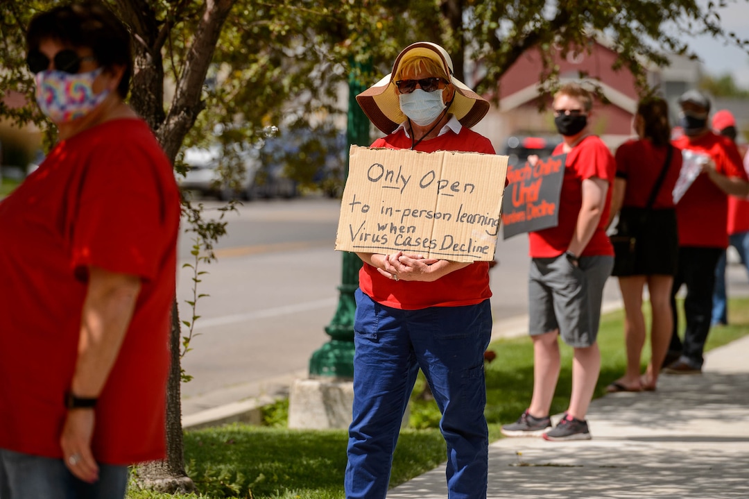 (Trent Nelson  |  The Salt Lake Tribune) Glenda Adams, a teacher at South Jordan Elementary, joined other teachers and parents holding signs calling for a safe plan on reopening schools prior to a Jordan School District board meeting in Riverton on Tuesday, July 28, 2020.