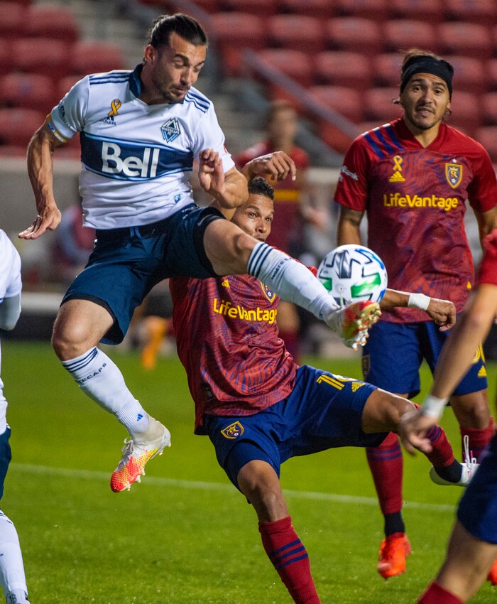 (Rick Egan  |  The Salt Lake Tribune)   Vancouver Whitecaps midfielder Russell Teibert (31) collides with Real Salt Lake midfielder Maikel Chang (16), in MLS soccer action between Real Salt Lake and the Vancouver Whitecaps at Rio Tinto Stadium on Saturday, Sept. 19, 2020.

 