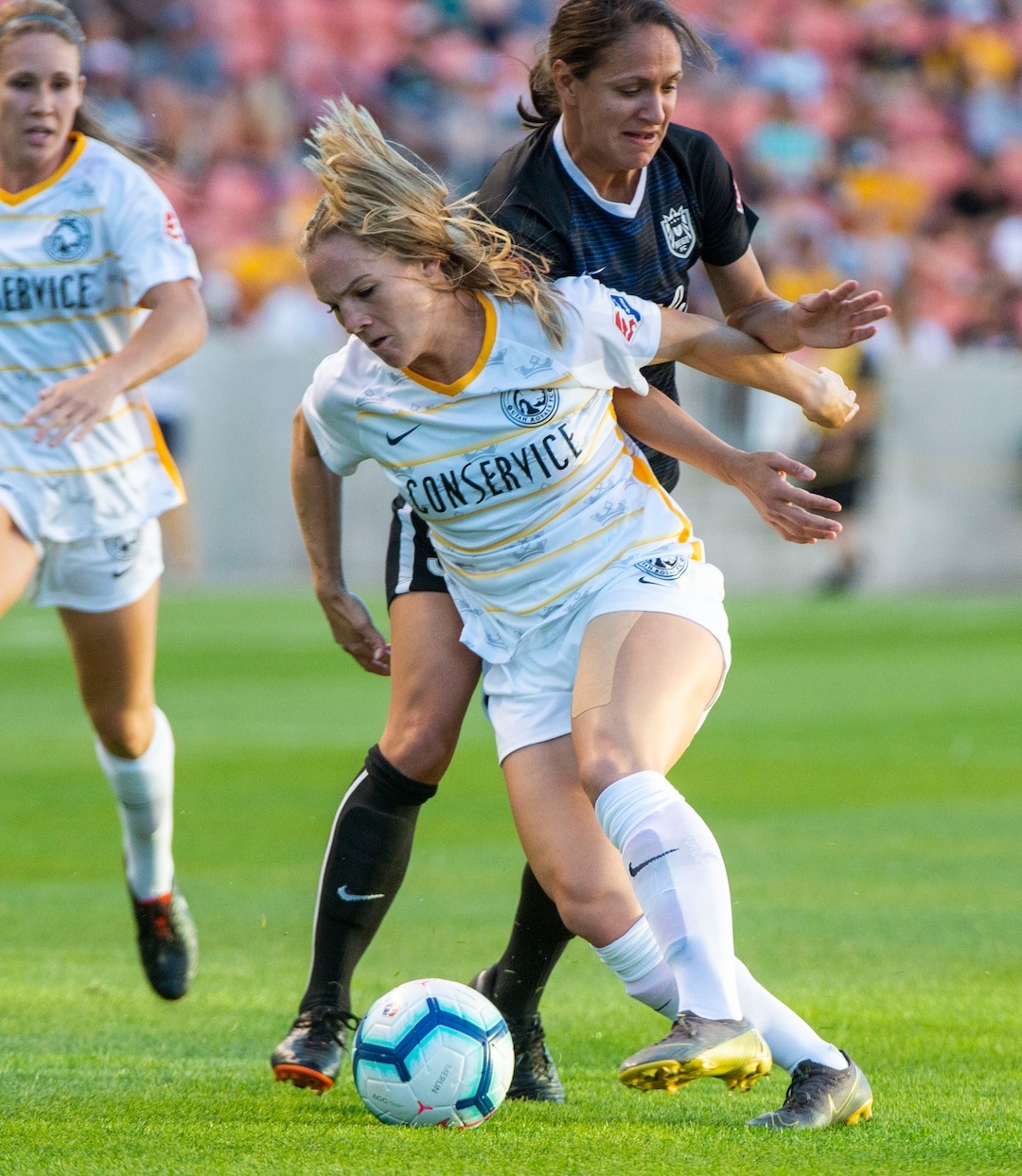 (Rick Egan  |  The Salt Lake Tribune)   Seattle Reign FC defender Theresa Nielsen (8) goes for the ball along with Seattle Reign FC defender Steph Cox, in soccer action between Utah Royals FC and Seattle Reign FC in Sandy, Friday, June 28, 2019.