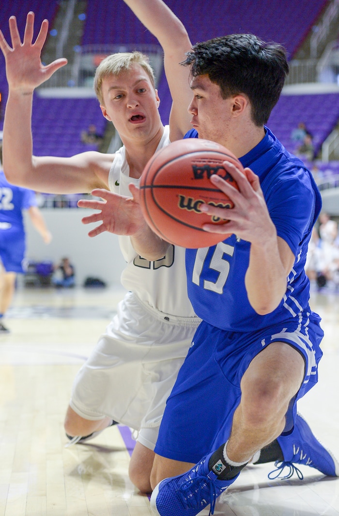 (Leah Hogsten  |  The Salt Lake Tribune) Bingham's Peyton Jones (15) steals from Copper Hills' Bryan Holgate (25). Copper Hills defeated Bingham 61-54 in the 6A High School Boys' Basketball Tournament opening game at Weber State University’s Dee Events Center in Ogden, Tuesday, Feb. 27, 2018. 