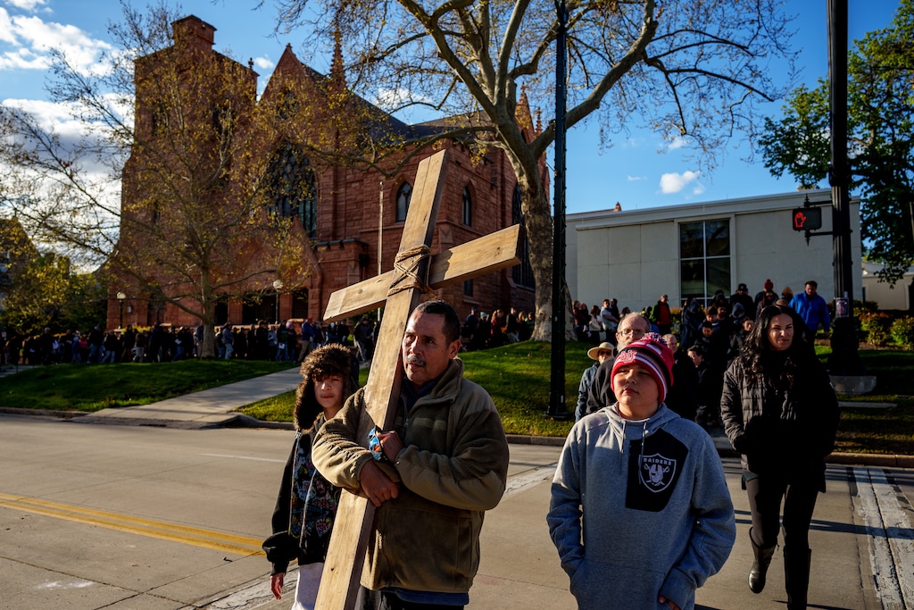 (Trent Nelson  |  The Salt Lake Tribune) John Salazar carries the cross in the annual Good Friday procession in Salt Lake City in April 2025. A new study shows more Americans believe religion's influence is on the rise.