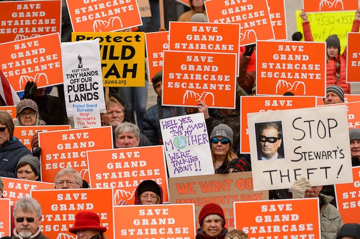 (Trent Nelson | The Salt Lake Tribune) Citizens with signs at a rally on the steps of the State Capitol Building in Salt Lake City against Rep. Chris Stewart's Grand Staircase bill that would create an Escalante National Park. Tuesday December 12, 2017.
