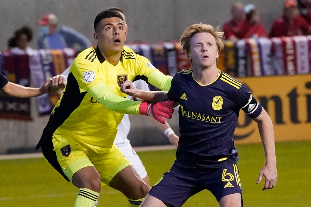 (Rick Bowmer | AP) Real Salt Lake goalkeeper David Ochoa, left, and Nashville SC midfielder Dax McCarty (6) battle for position during the second half of an MLS soccer match on May 15, 2021, in Sandy. Ochoa faced 29 shots and had eight saves against FC Dallas on Saturday, May 22, 2021, in Frisco Texas.
