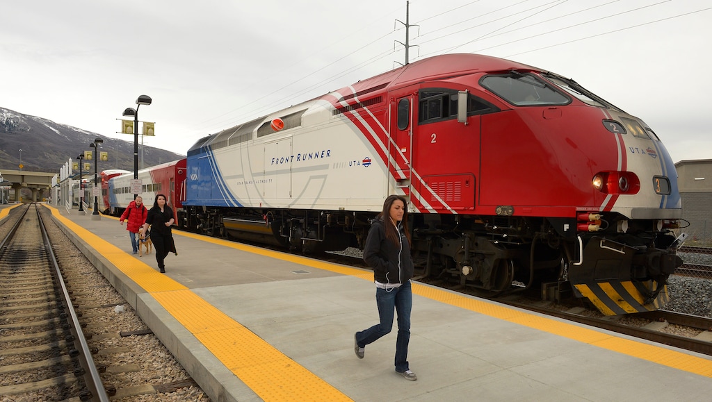 (Rick Egan | Tribune file photo) Passengers exit the FrontRunner at Farmington Station.