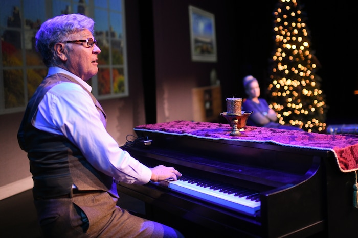 (Photos courtesy of Purdie Distribution) John (Michael McLean, left) plays a song for Constance (Adrien Swenson), a nurse sent to care for the old man, in the movie version of McLean's "The Forgotten Carols."