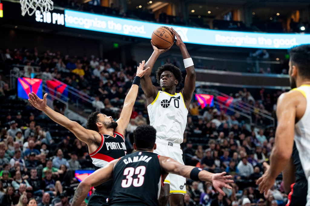 (Isaac Hale | AP) Utah Jazz forward Taylor Hendricks (0) shoots the ball while contested by Portland Trail Blazers guard Skylar Mays (5) during the second half of an NBA preseason basketball game Saturday, Oct. 14, 2023, in Salt Lake City.