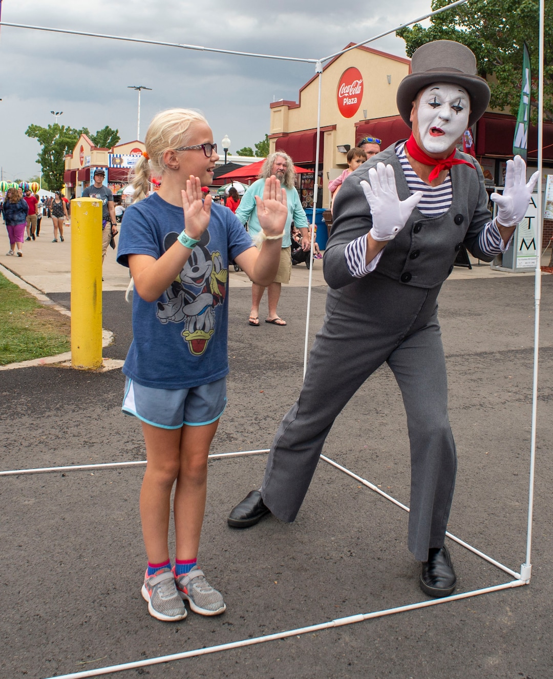 (Rick Egan  |  The Salt Lake Tribune)   Ella Nay 9, from West Jordan is trapped in an imaginary box with Chris Yerlig aka "Mimealot" at the Utah State Fair, Sunday, Sept. 8, 2019.