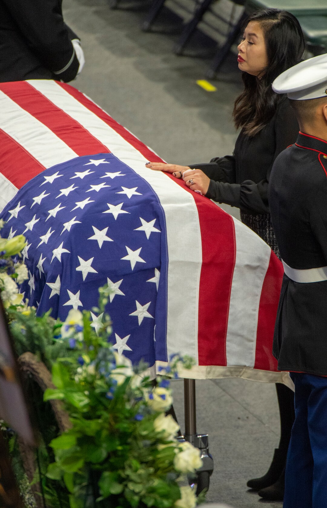 (Rick Egan  |  The Salt Lake Tribune)     Elizabeth Romrell spends a moment  by the casket of her husband, South Salt Lake police officer, David Romrell, before his funeral at the Maverik Center, in West Valley City, Wednesday, Dec. 5, 2018.