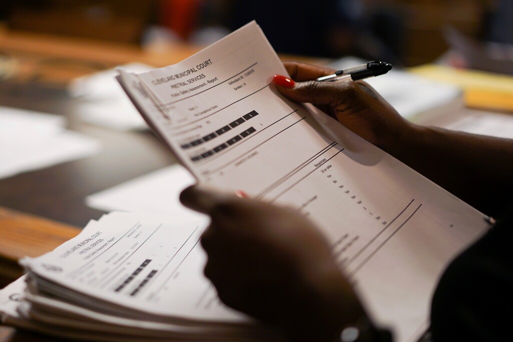 (Dake Kang | AP) A probation officer in Cleveland sorts through defendant files in this Aug. 30, 2017, photo. Newly released audits show the Utah agency that oversees people on parole and probation doesn’t have enough experienced staff to keep up with increasing demand for high-risk offender supervision.