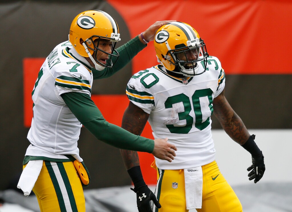 Green Bay Packers running back Jamaal Williams (30) celebrates with quarterback Brett Hundley (7) after Williams scored a touchdown in the first half of an NFL football game against the Cleveland Browns, Sunday, Dec. 10, 2017, in Cleveland. (AP Photo/Ron Schwane)