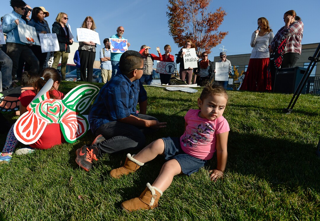 (Francisco Kjolseth  |  The Salt Lake Tribune)  Natalie Fajardo, 3, joins community members as they rally in front of the Immigration and Customs Enforcement offices in West Valley City on Monday, Oct. 16, 2017, to support her mother Maria Santiago Garcia, a single Utah mother of four U.S. born children who faces an impending deportation order.