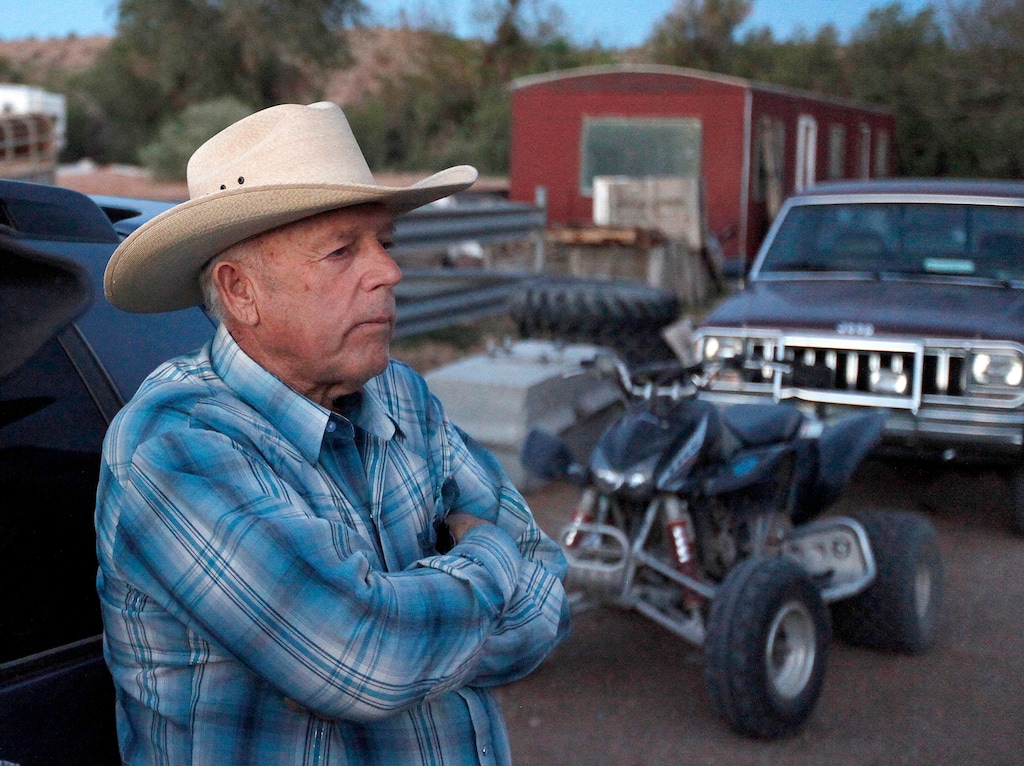FILE - In this Saturday, April 5, 2014 file photo, Cliven Bundy, stands at the Bundy ranch near Bunkerville Nev. Bundy's defense attorney, Bret Whipple, is seeking to withdraw from Nevada cattleman and state's rights figure's case, less than three weeks before trial begins for Bundy and six other defendants. (John Locher/Las Vegas Review-Journal via AP, File)