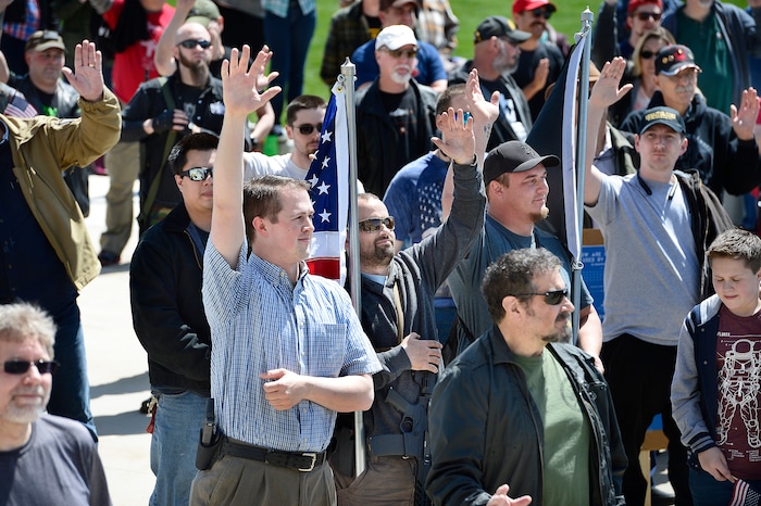 (Scott Sommerdorf | The Salt Lake Tribune)
People attending a rally in support of the second amendment raise their hands as a speaker asked who in attendance were carrying firearms. A group calling themselves Citizens and Students For Liberty (SFL) gathered at the Utah State Capitol on Saturday to show their support for the Second Amendment, Saturday, April 14, 2018.
