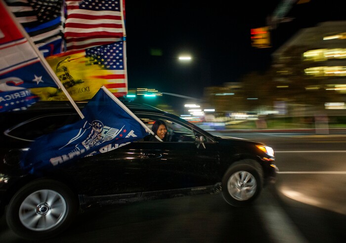 (Rick Egan | The Salt Lake Tribune)  Trump supporters, drive down State Street, on Monday, Nov. 2, 2020.