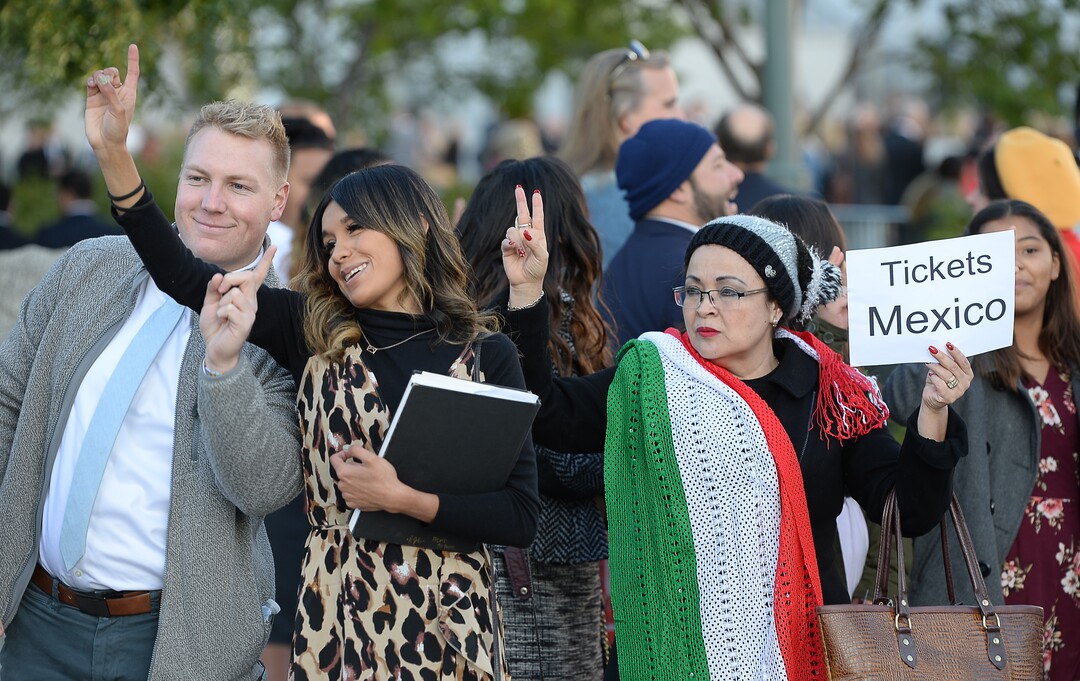 (Francisco Kjolseth  |  The Salt Lake Tribune)  Jake Schoeneman, Karina Galicia and Merlita Casillas, from left, try for an entry ticket as people arrive for the Sunday session of the 189th twice-annual General Conference of The Church of Jesus Christ of Latter-day Saints at the Conference Center in Salt Lake City on Sunday, Oct. 6, 2019.
