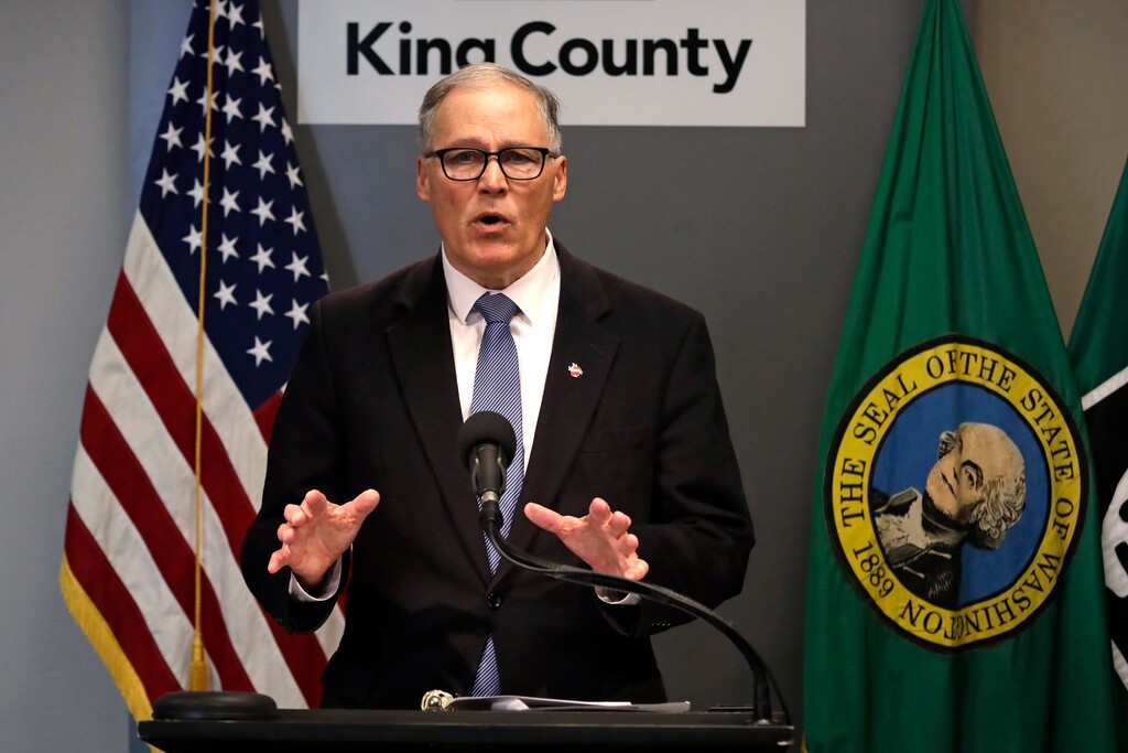 FILE - In this March 16, 2020, photo Washington Gov. Jay Inslee speaks about the coronavirus outbreak in Seattle. Inslee ordered all bars, restaurants, entertainment and recreation facilities to temporarily close to fight the spread of COVID-19 in the state with by far the most deaths in the U.S. from the disease. (AP Photo/Elaine Thompson, Pool)