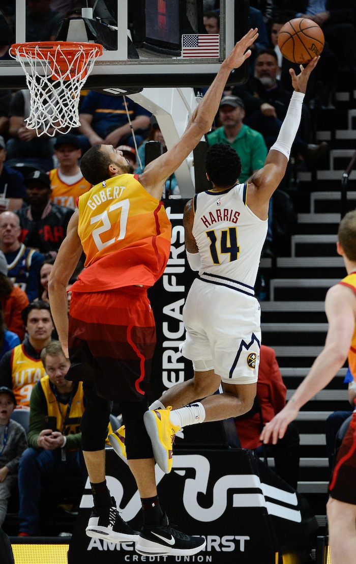 (Francisco Kjolseth  |  The Salt Lake Tribune)  Utah Jazz center Rudy Gobert (27) defends Denver Nuggets guard Gary Harris (14) as the Utah Jazz host the Denver Nuggets in their NBA game at Vivint Smart Home Arena Tuesday, April 9, 2019, in Salt Lake City.