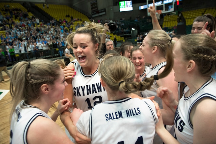 Scott Sommerdorf | The Salt Lake TribuneLauren Gustin celebrates with team mates after winning the state title. Salem Hills beat Hurricane 57-35 for the 4A girl's title, Saturday, March 3, 2018.