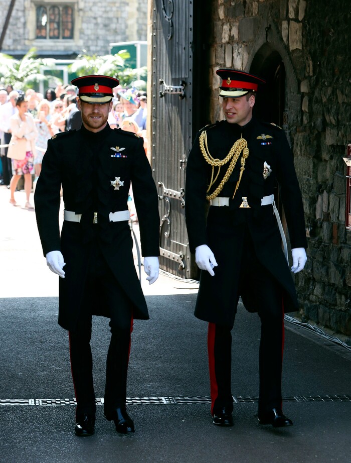 Britain's Prince Harry walks with his best man, Prince William,  the Duke of Cambridge, as they arrive for the wedding ceremony of Prince Harry and Meghan Markle at St. George's Chapel in Windsor Castle in Windsor, near London, England, Saturday, May 19, 2018. (Ben Birchhall/pool photo via AP)