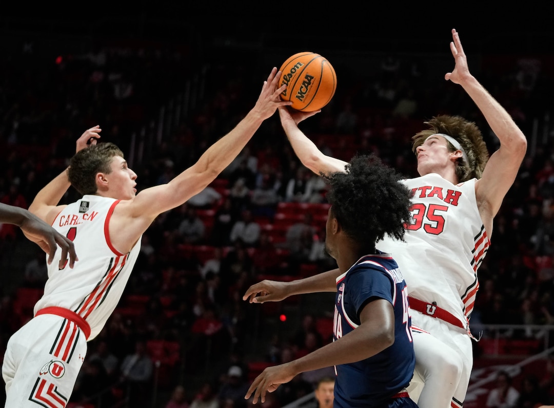 (Francisco Kjolseth | The Salt Lake Tribune) Utah Utes forward Ben Carlson (1) and Utah Utes center Branden Carlson (35) get the rebound as the University of Utah hosts the Arizona Wildcats in NCAA basketball in Salt Lake City on Thursday, Dec. 1, 2022.