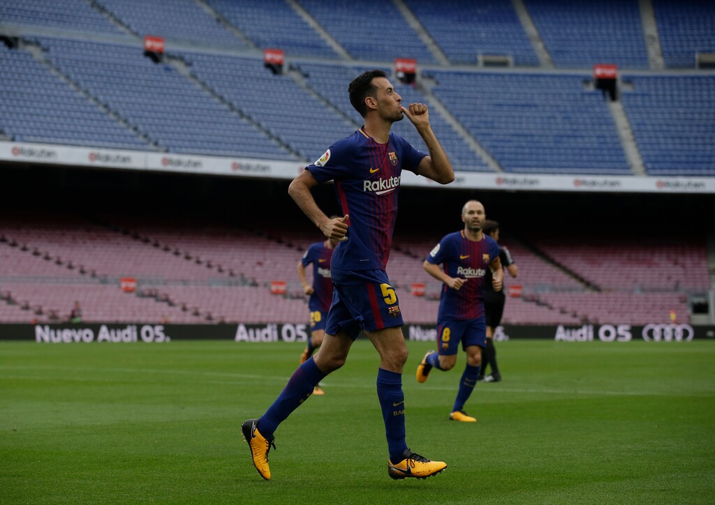 Barcelona's Sergio Busquets celebrates his goal during the Spanish La Liga soccer match between Barcelona and Las Palmas at the Camp Nou stadium in Barcelona, Spain, Sunday, Oct. 1, 2017. Barcelona's Spanish league game against Las Palmas is played without fans amid the controversial referendum on Catalonia's independence. (AP Photo/Manu Fernandez)