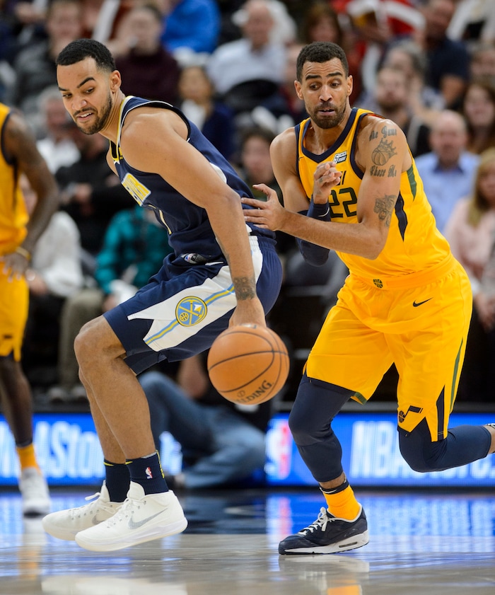 (Steve Griffin  |  The Salt Lake Tribune) Utah Jazz forward Thabo Sefolosha (22), right, strips Denver Nuggets forward Trey Lyles (7) of the ball during the Utah Jazz versus Denver Nuggets NBA basketball game at Vivint Smart Home Arena  in Salt Lake City Tuesday November 28, 2017.