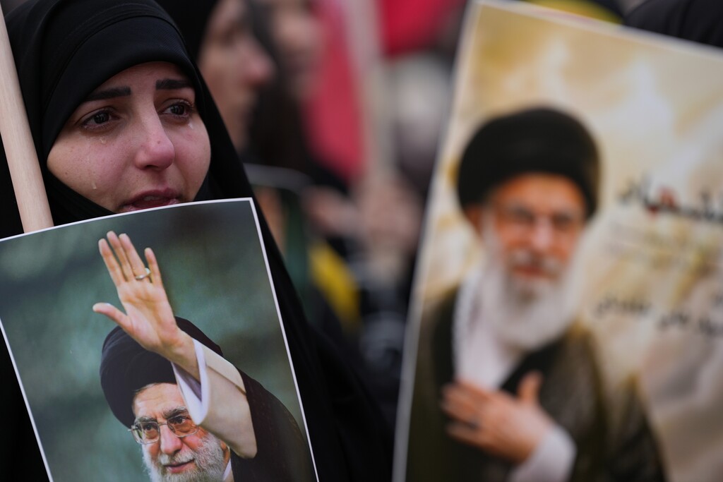 (Hassan Ammar | AP) A woman cries as she mourns the death of Iranian Supreme Leader Ayatollah Ali Khamenei, during a gather in the southern Suburb of Beirut, Lebanon, Sunday, March 1, 2026.