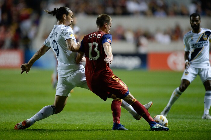 (Francisco Kjolseth  |  The Salt Lake Tribune) Los Angeles Galaxy forward Zlatan Ibrahimovic (9) battles Real Salt Lake midfielder Nick Besler (13) during the first half of the MLS soccer match Saturday, Sept. 1, 2018, in Sandy at Rio Tinto Stadium.