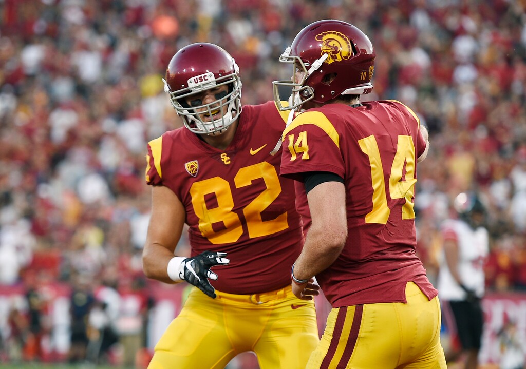 Southern California quarterback Sam Darnold, right, celebrate with tight end Tyler Petite after a touchdown catch by Petite during the first half of an NCAA college football game against Utah in Los Angeles, Saturday, Oct. 14, 2017. (AP Photo/Kelvin Kuo)