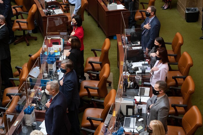 (Francisco Kjolseth  | The Salt Lake Tribune) Members of the House of Representatives are partitioned by plexiglass as they recite the pledge of allegiance as the Utah State Legislature opens the 2021 legislative session at the Capitol in Salt Lake City on Tuesday, Jan. 19, 2021.