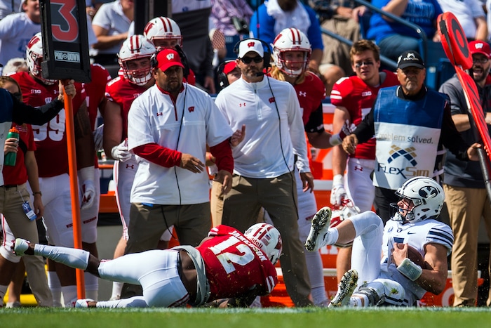 (Chris Detrick  |  The Salt Lake Tribune)   Wisconsin Badgers safety Natrell Jamerson (12) tackles Brigham Young Cougars quarterback Beau Hoge (7) during the game at LaVell Edwards Stadium Saturday Saturday, September 16, 2017. Wisconsin Badgers are leading Brigham Young Cougars 24-6 at halftime.