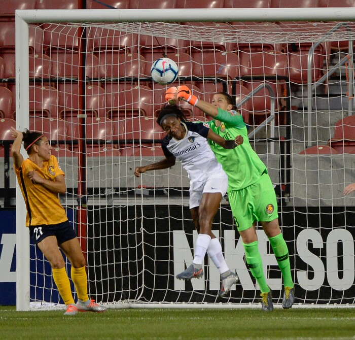 (Francisco Kjolseth  |  The Salt Lake Tribune)  Utah Royals FC goalkeeper Nicole Barnhart (18) blocks an attempt on goal by North Carolina Courage forward Lynn Williams (9) as Utah Royals FC hosts the North Carolina Courage at Rio Tinto Stadium in Sandy, Utah on Saturday, July 27, 2019.