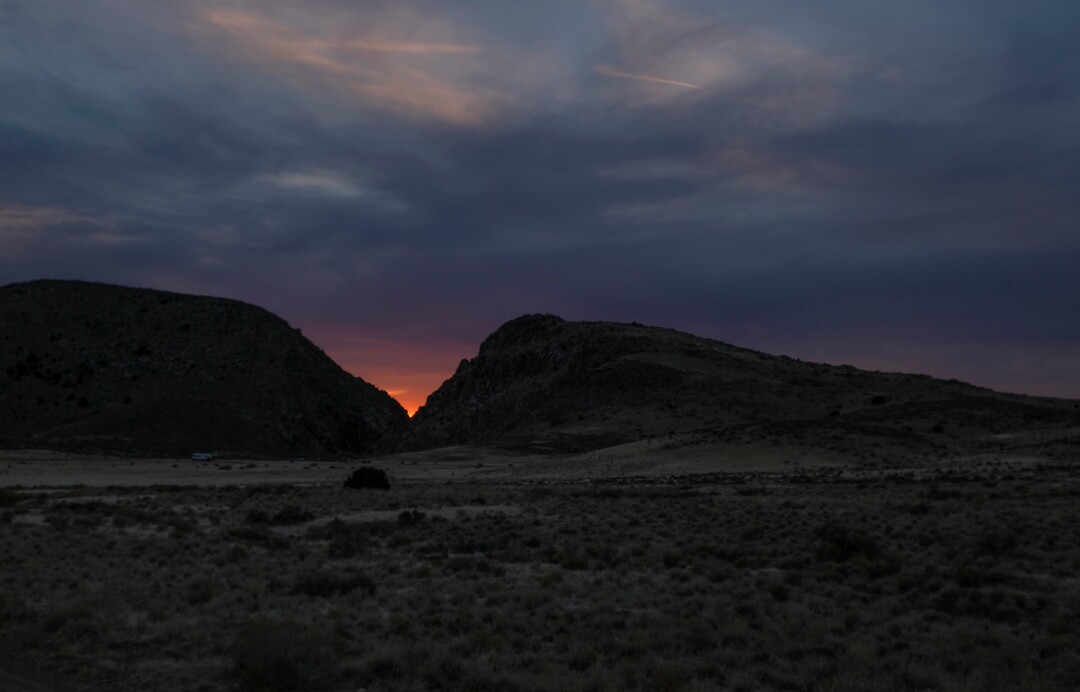 (Leah Hogsten | The Salt Lake Tribune)  The sun is shown setting within the vee of the Parowan Gap, a day prior to the spring equinox observance, Saturday, Mar. 19, 2021.