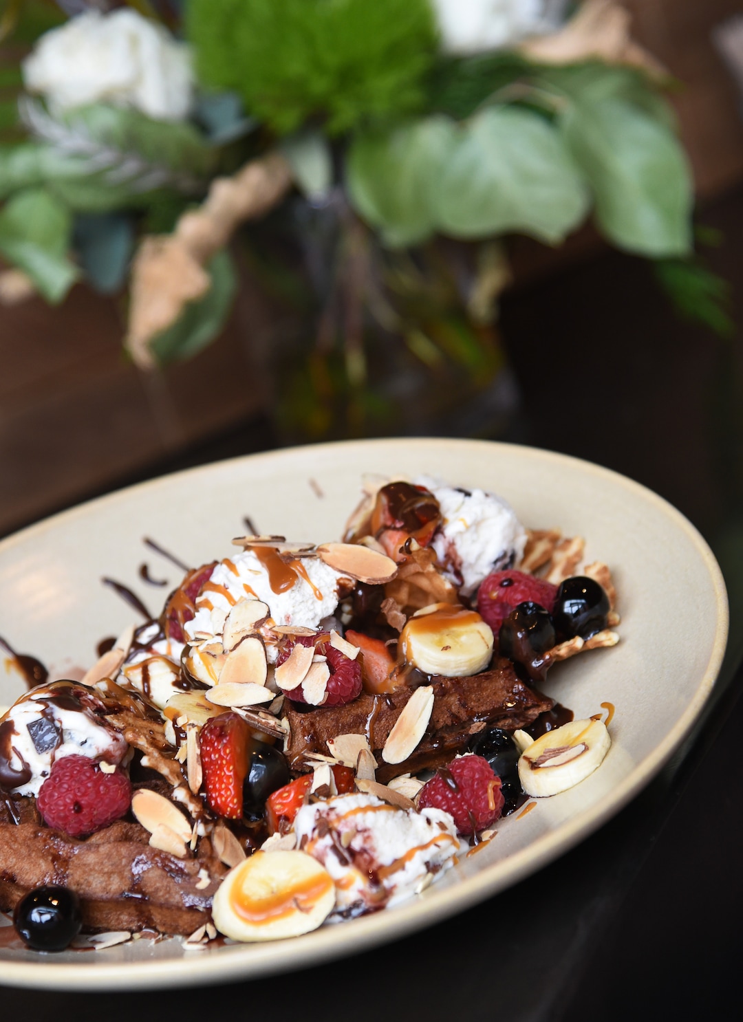 (Francisco Kjolseth  |  The Salt Lake Tribune)  Sundae Nachos with chocolate waffle, puzzle cookies, banana, coconut almond ice cream, hot fudge, caramel sauce, fresh berries, almonds and whipped cream at Hearth & Hill a new restaurant in Kimball Junction that serves upscale comfort food at 1153 Center Drive in the Newpark Retail Center is one of the new restaurants available to try before (or after) the Sundance Film Festival. 