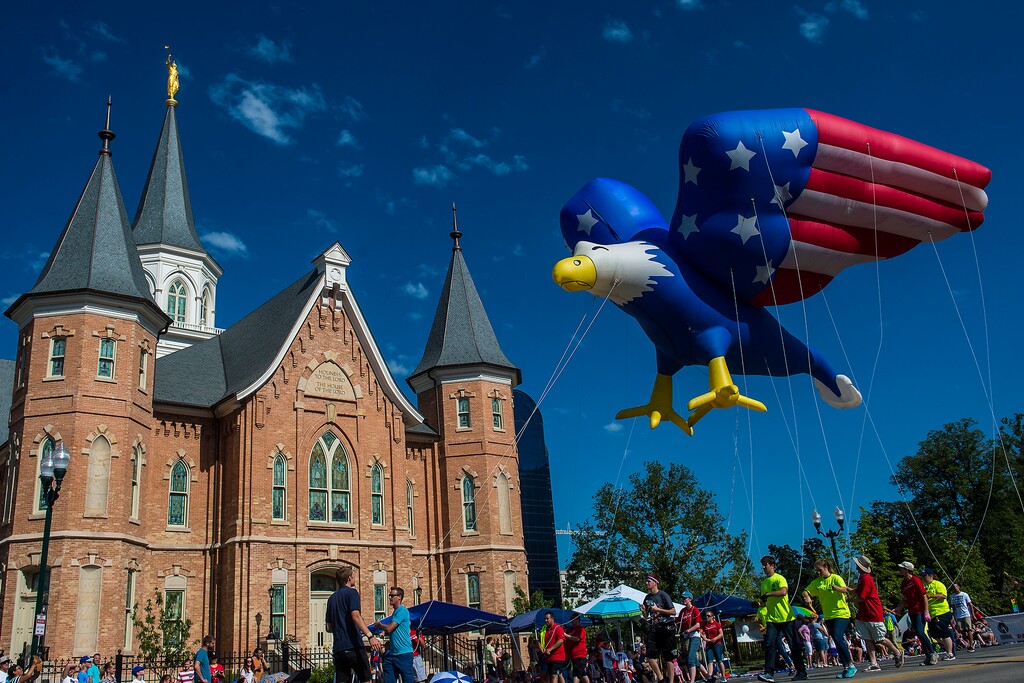 Chris Detrick  |  The Salt Lake TribuneAn inflatable eagle flies by the Provo City Center Temple during the annual Freedom Festival Grand Parade in downtown Provo Tuesday, July 4, 2017. 