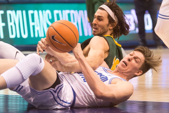 (Rick Egan  |  The Salt Lake Tribune)     Brigham Young Cougars forward Dalton Nixon (33) goes for a loose ball along with San Francisco Dons forward Matt McCarthy (10), in basketball action at the Marriott Center, Saturday, February 10, 2018.