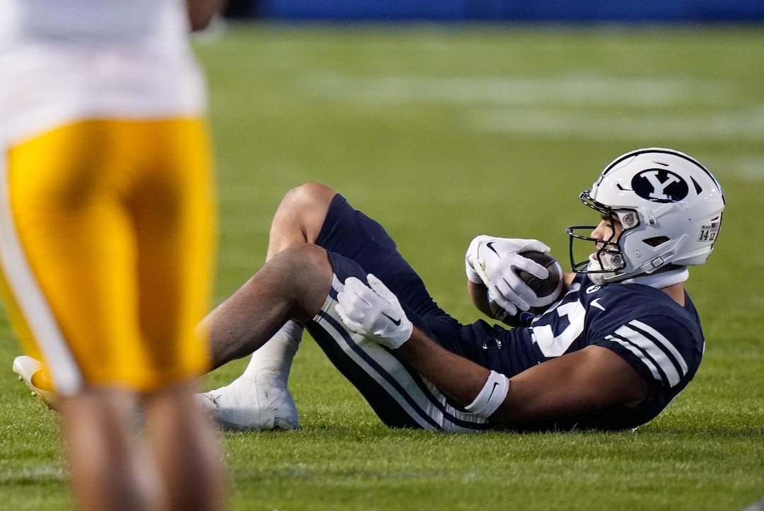 (Francisco Kjolseth | The Salt Lake Tribune) Brigham Young Cougars wide receiver Puka Nacua (12) is injured in game action between the Brigham Young Cougars and the Wyoming Cowboys at LaVell Edwards Stadium in Provo, on Saturday, Sept. 24, 2022.