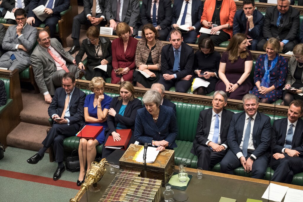 (Mark Duffy | UK Parliament via AP) Backdropped by members of the ruling Conservative Party, Britain's Prime Minister Theresa May, centre, stands as she speaks during the regular scheduled Prime Minister's Questions inside the House of Commons in London, Wednesday Dec. 12, 2018. May has confirmed there will be a vote of confidence in her leadership of the Conservative Party, later Wednesday, with the result expected to be announced soon after.