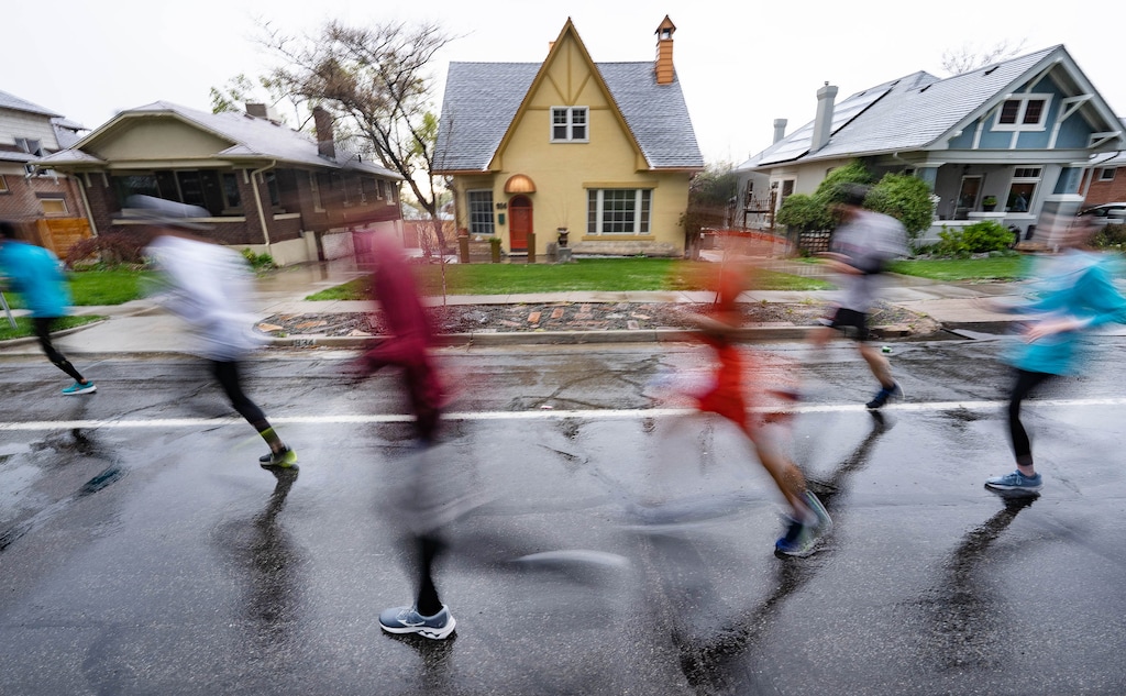 (Francisco Kjolseth | The Salt Lake Tribune) Runners endure cold wet conditions as they participate in the Salt Lake City Marathon on Saturday, April 23, 2022.