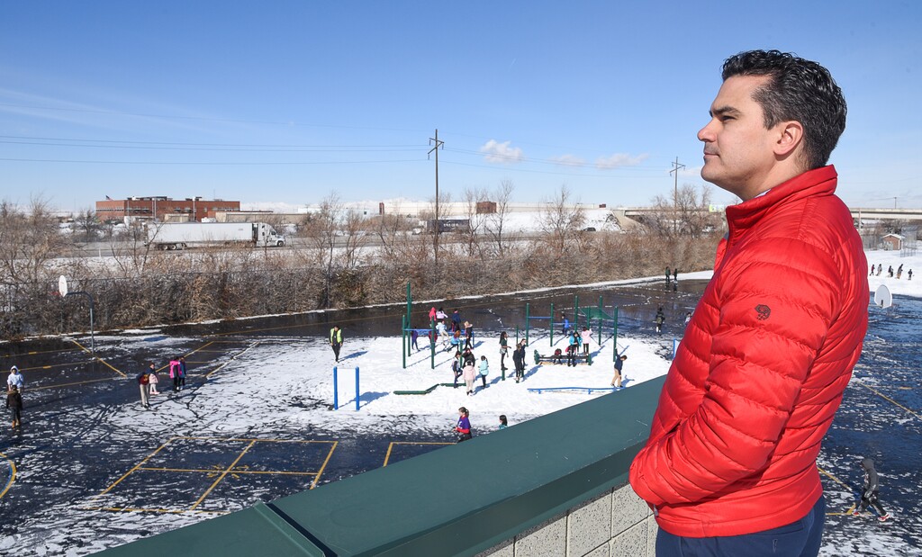 (Francisco Kjolseth  |  The Salt Lake Tribune)  North Star Elementary principal Nathan Elkins gets an elevated view of students during recess as they play adjacent to I-215 on Monday, Feb. 11, 2019. With 530 students in Pre-K through 6th grade, it is one of the closest schools to the planned inland port development, located less than a mile away. The inland port, a massive development planed for Salt Lake City's westernmost area is cause for concern for the Salt Lake City School District through possible impacts in air quality and students, who they already have to keep inside from recess on bad air days.
