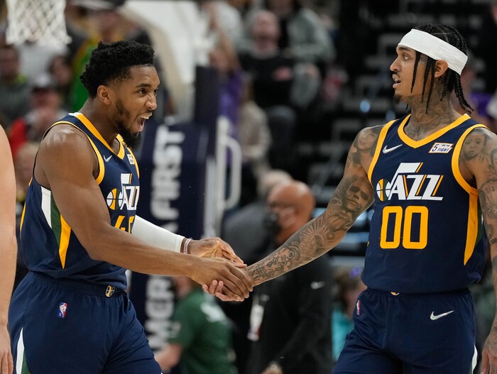 (Francisco Kjolseth | The Salt Lake Tribune) Utah Jazz guard Donovan Mitchell (45) celebrates a big shot by Utah Jazz guard Jordan Clarkson (00) in NBA action between the Utah Jazz and the Minnesota Timberwolves at Vivint Smart Home Arena in Salt Lake City, Thursday, Dec. 23, 2021.