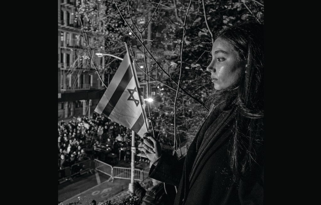 (Dave Sanders for The New York Times) Demonstrators at a vigil in Manhattan, 30 days after the start of the war between Israel and Hamas.