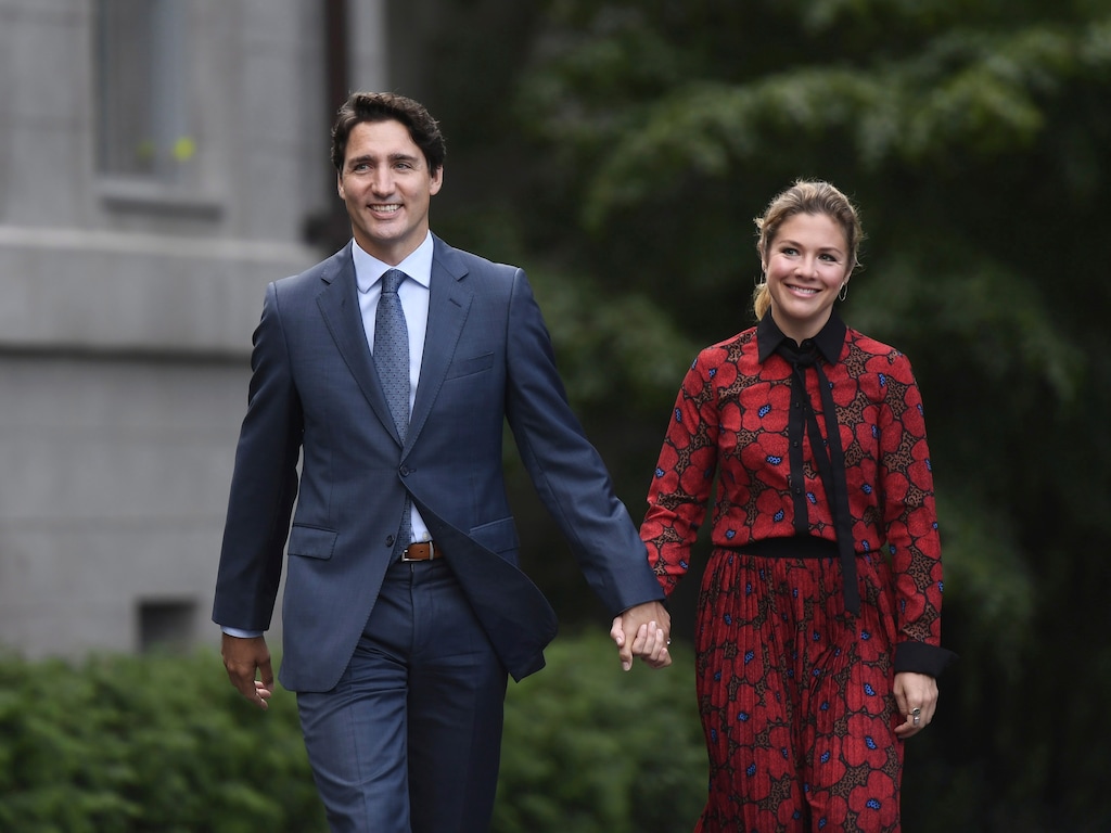 (Justin Tang | The Canadian Press via AP) In this Wednesday, Sept. 11, 2019 photo, Canada's Prime Minister Justin Trudeau and his wife Sophie Gregoire Trudeau arrive at Rideau Hall in Ottawa, Ontario. Trudeau is quarantining himself at home after his wife exhibited flu-like symptoms. Trudeau's office said Thursday, March 12, 2020, that Sophie Grégoire Trudeau returned from a speaking engagement in Britain and had mild flu-like symptoms, including a low fever late, Wednesday night. (Justin Tang/The Canadian Press via AP)