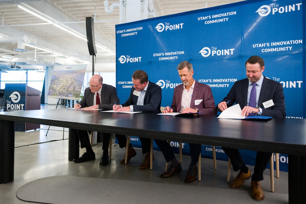 (Trent Nelson  |  The Salt Lake Tribune) Alan Matheson, Lance Bullen, Kip Wadsworth and Patrick Gilligan sign the agreement for the first phase of redevelopment at The Point in Draper on Monday, Nov. 27, 2023.