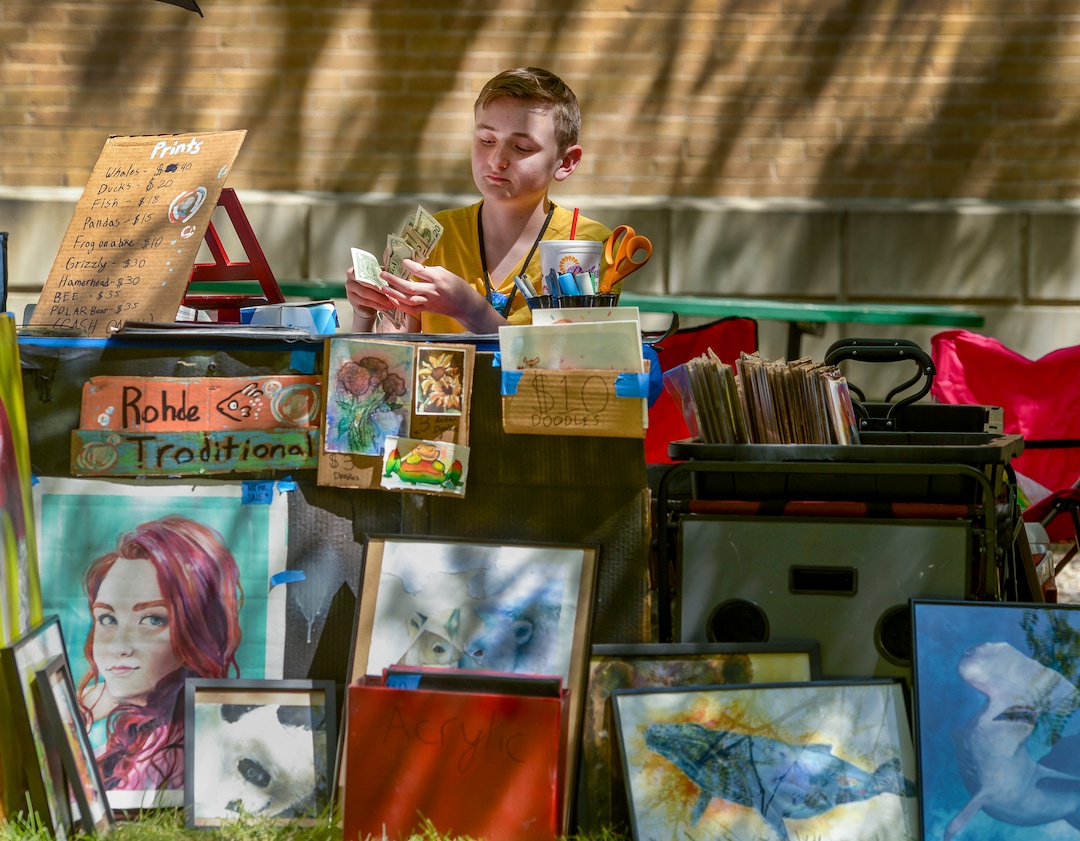 (Leah Hogsten  |  The Salt Lake Tribune)  Mixed media artist Lucas Rohde, 14, counts his proceeds from his art sales at the Craft Lake City DIY Festival Kid Row, where children 14 and under make and sell their products. Craft Lake CityÕs DIY Festival is UtahÕs largest local, three day arts festival with over 300 artisans, DIY engineers, vintage vendors and craft food creators.