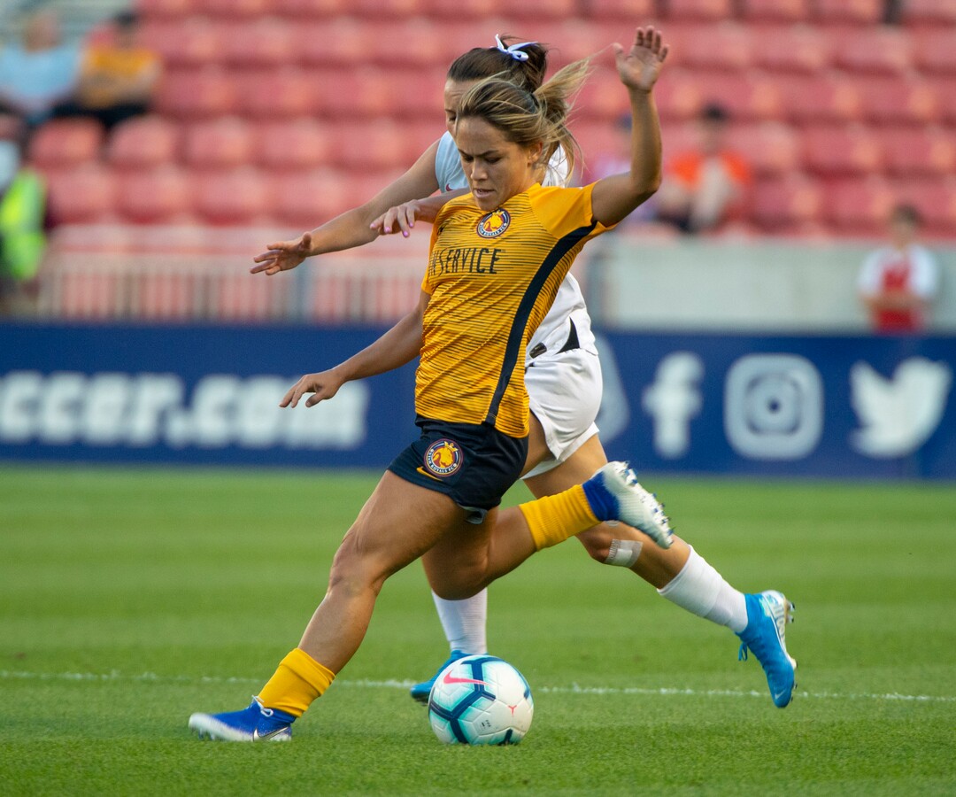 (Rick Egan  |  The Salt Lake Tribune)    Utah Royals FC midfielder Lo'eau LaBonta (9) goes for the ball along with Portland Thorns FC defender Elizabeth Ball (27), in Soccer action between Utah Royals FC and Portland Thorns FC, in Sandy, Friday, July 19, 2019.