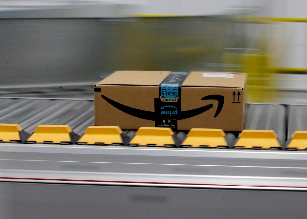 FILE- In this Feb. 9, 2018, file photo, a box for an Amazon prime customer moves through the new Amazon Fulfillment Center in Sacramento, Calif. (AP Photo/Rich Pedroncelli)