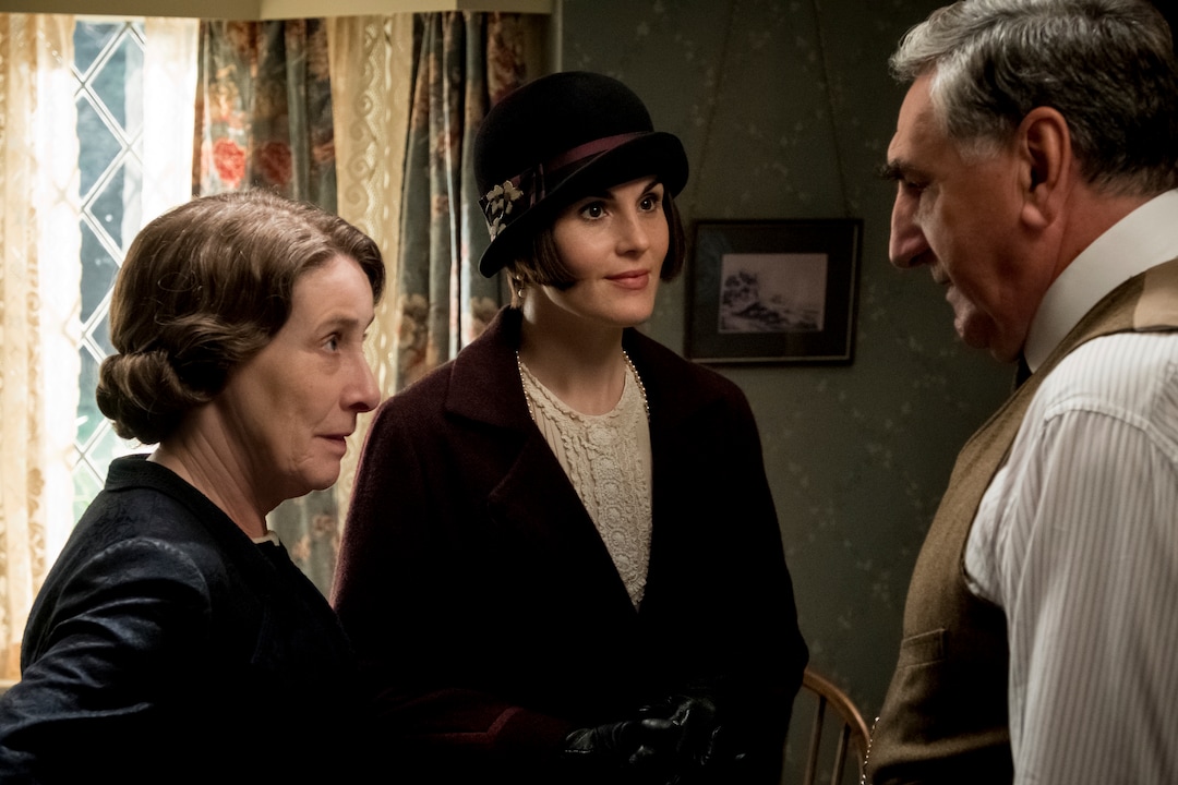 This image released by Focus Features shows, from left, Phyllis Logan as Mrs. Hughes, Michelle Dockery as Lady Mary Talbot and Jim Carter as Mr. Carson in "Downton Abbey". The film will be released Sept. 13, 2019, in the United Kingdom and on Sept. 20 in the United States. (Jaap Buitendijk/Focus Features via AP)