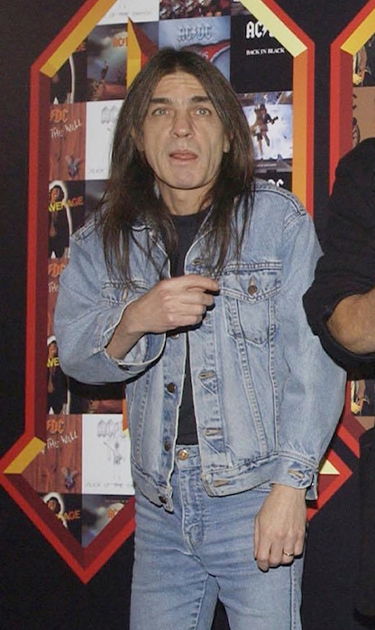 FILE -  A March 3, 2003 file photo of AC/DC co-founder and guitarist Malcolm Young at an event in London. The band has announced, Saturday Nov. 18, 2017,  that 64-year-old Young has died. (Yui Mok/PA via AP)