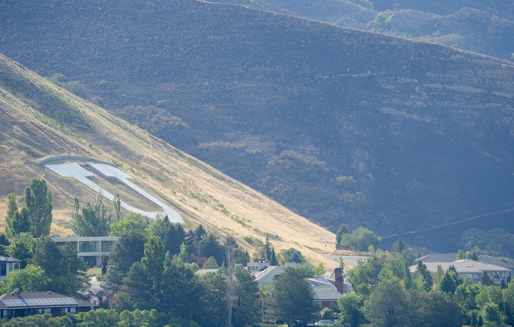 (Chris Samuels | The Salt Lake Tribune) The Bonneville Fire is seen near the block U in Salt Lake City, Monday, June 22, 2026.